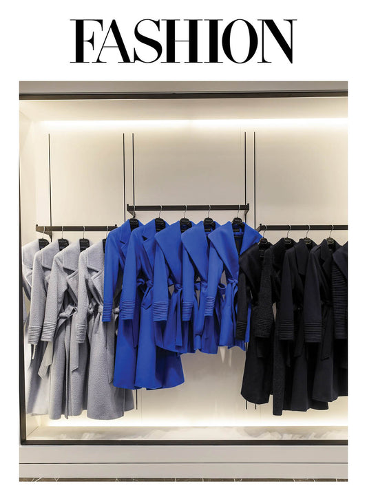 Image features the Fashion logo and an image of SENTALER wrap coats in Powder Blue, Cobalt Blue and Deep Navy on a rack at the SENTALER Flagship at 55 Avenue Road.