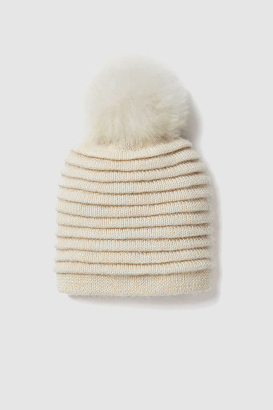 Sentaler Adult Ribbed Hat With Oversized Fur Pompon featured in Baby Alpaca and available in Ivory White. Seen as off figure.