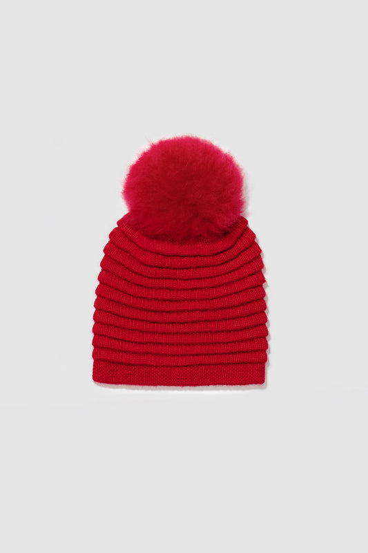 Sentaler Kids (6-14 Years) Ribbed Hat with Oversized Fur Pompon featured in Baby Alpaca and available in Red. Seen as off figure.