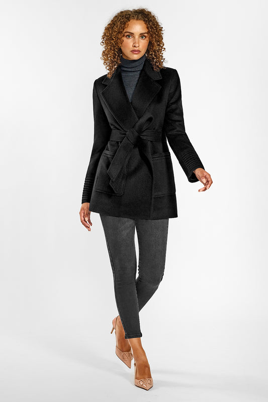 Sentaler Cropped Notched Collar Wrap Coat with Square Pockets featured in Baby Alpaca and available in Black. Seen from front on female model who is wearing the coat belted.