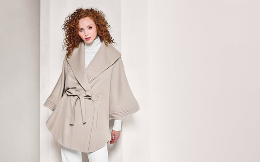 Sentaler Cape with Shawl Collar and Belt featured in Baby Alpaca and available in Bleeker Beige. Seen from front on female model above the knees.