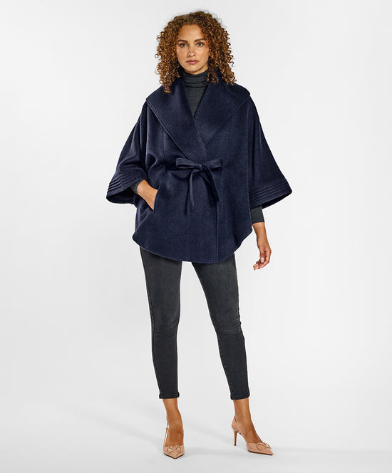 Sentaler Cape with Shawl Collar and Belt crafted in Baby Alpaca and in Deep Navy Blue. Seen from front on female model.