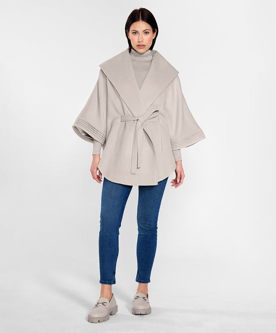 Sentaler Cape with Shawl Collar and Belt featured in Baby Alpaca and available in Bleeker Beige. Seen from front on female model.