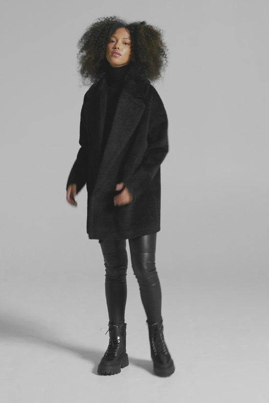 Sentaler Bouclé Alpaca Mid Length Oversized Notched Collar Coat featured in Bouclé Alpaca and available in Black. Seen as product video.