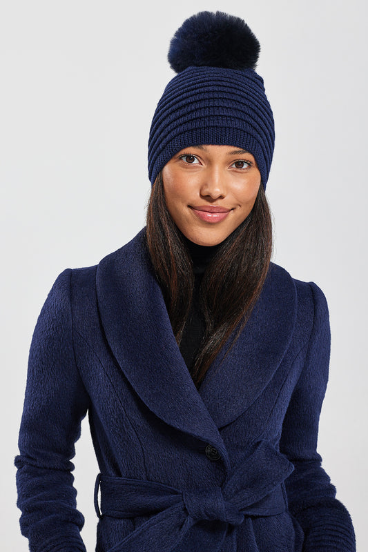 Sentaler Adult Ribbed Hat With Oversized Fur Pompon featured in Baby Alpaca and available in Navy. Seen from front 1.
