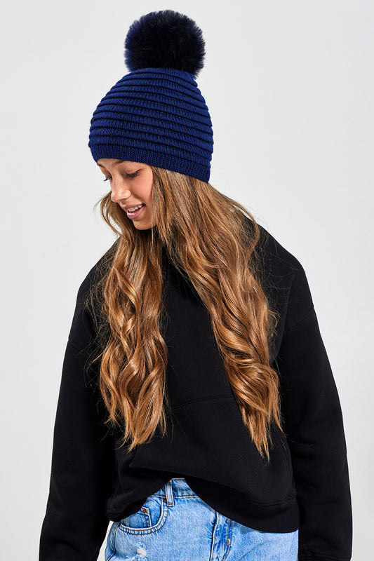 Sentaler Kids (6-14 Years) Ribbed Hat with Oversized Fur Pompon featured in Baby Alpaca and available in Navy. Seen from front.